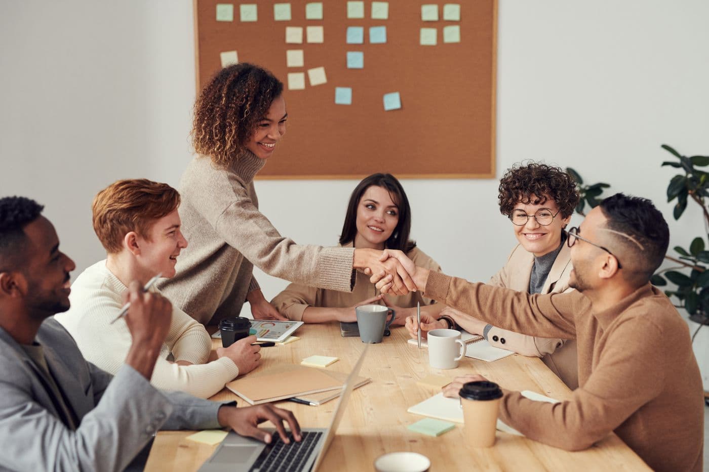 A small team working through a problem together around a table